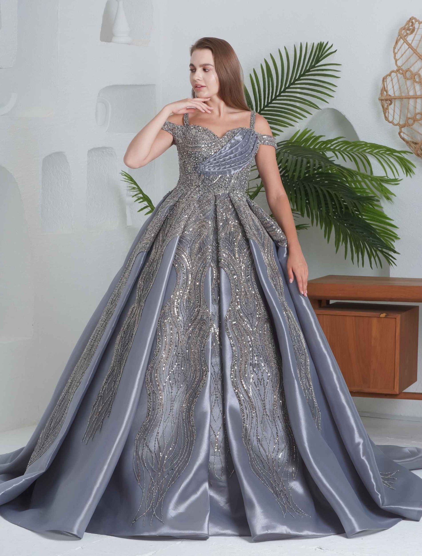 Luxurious silver ball gown with heavy embroidery and structured skirt. - Image 3