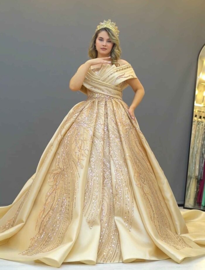 Champagne gold ball gown with off-shoulder neckline and glitter embroidery