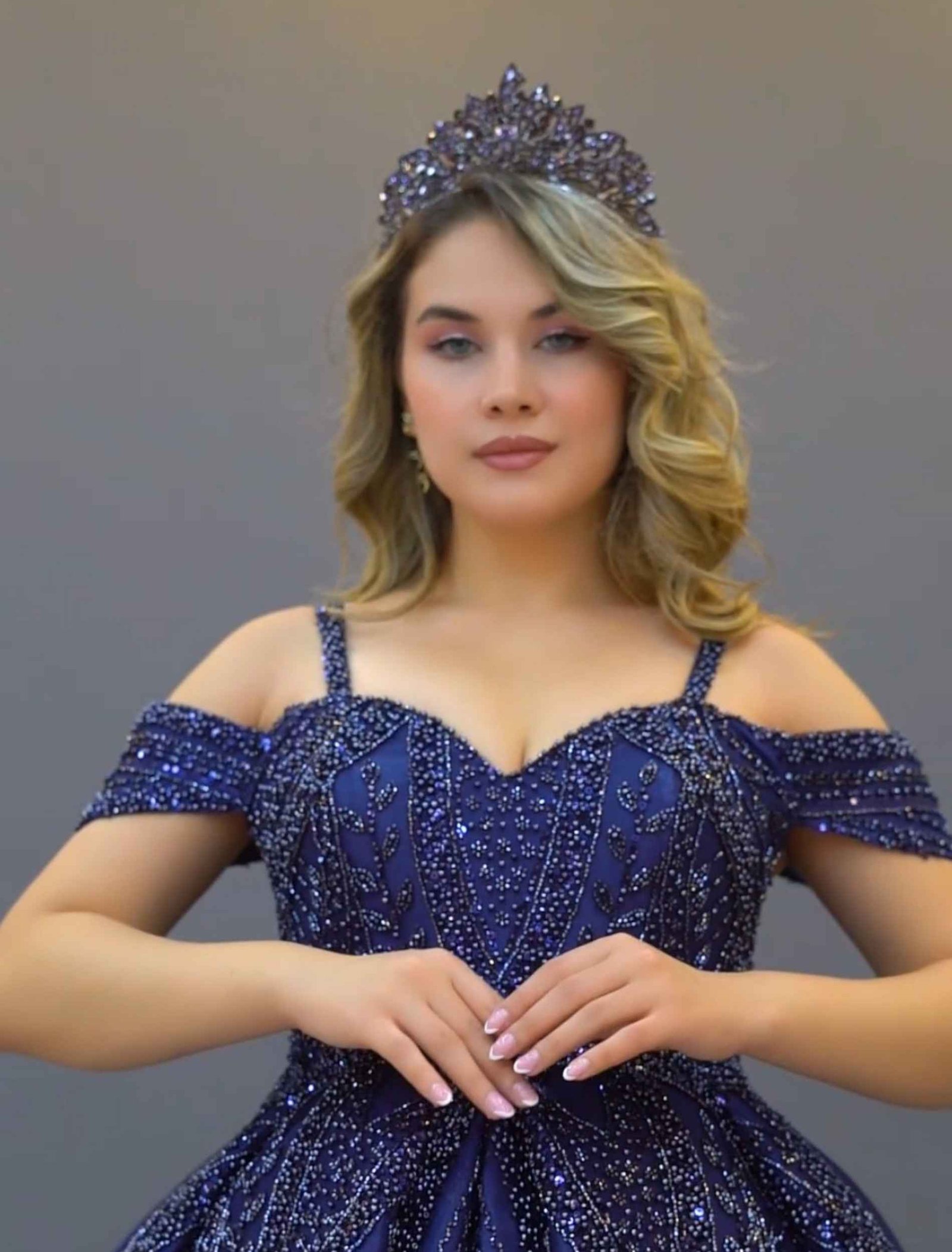 Elegant navy blue ball gown and glitter embroidery.